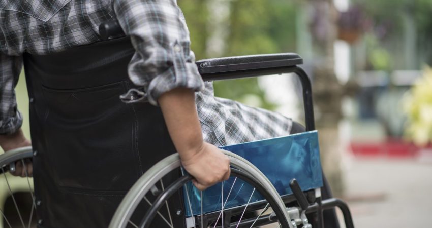 close-up-senior-woman-hand-wheel-wheelchair-walk-hospital